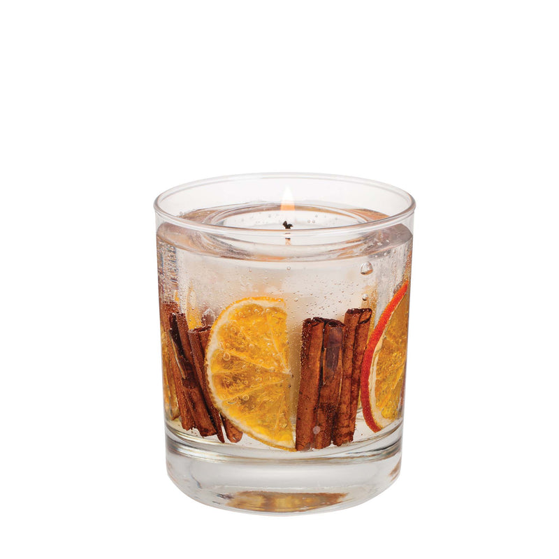 Festive Wishes natural wax botanical candle in a clear gel tumbler with dried orange slices and cinnamon sticks, white background