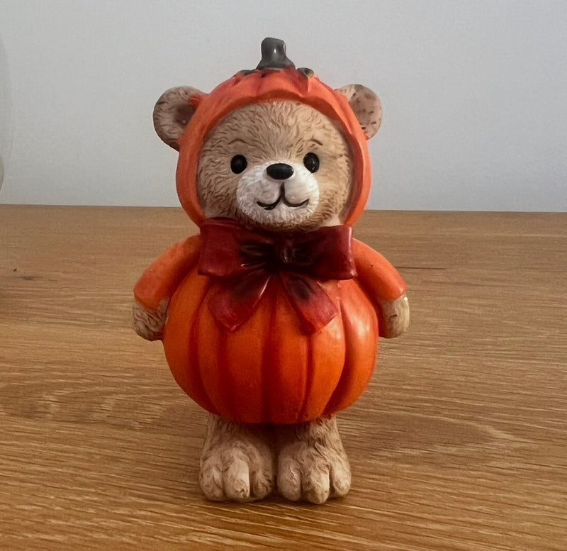 Harvest Home resin pumpkin bear figurine with pumpkin hood and pumpkin body, standing with a bow 