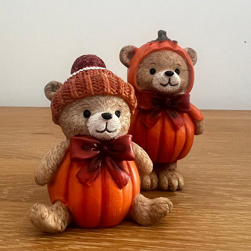 Harvest Home resin pumpkin bear figurines, bobble hat and pumpkin hood designs side by side