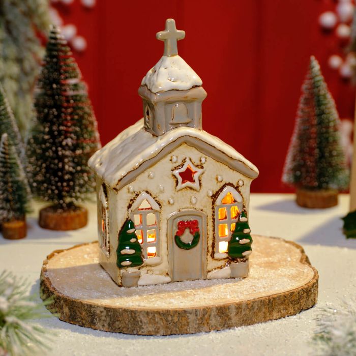 Stoneware Christmas church tealight holder with glowing arched windows, star cutout and painted Christmas trees, Stoneware Country Cottage Collection