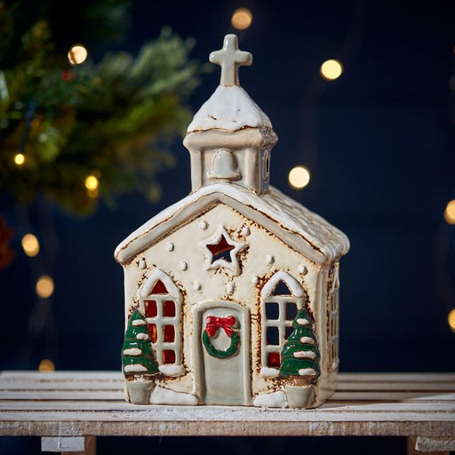 Stoneware Christmas church tealight holder with cross-topped steeple, festive wreath and snow-effect roof, Stoneware Country Cottage Collection