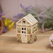 Stoneware greenhouse tealight holder with heart cutout, pastel bunting, panelled walls and embossed potted plant details, Stoneware Country Cottage Collection