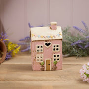 Pink stoneware cottage tealight holder with heart cutout, embossed pastel bunting and potted topiary trees, Stoneware Country Cottage Collection