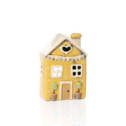 Front view of yellow stoneware cottage tealight holder with white roof, heart cutout and pastel bunting detail, Stoneware Country Cottage Collection