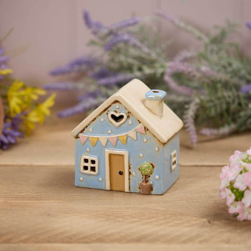 Blue stoneware cottage tealight holder with heart cutout, embossed bunting and potted plant detail, Stoneware Country Cottage Collection