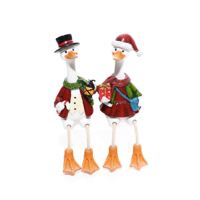 Mr and Mrs Christmas duck decorations with dangling legs — Mrs Duck in Santa hat with gift and blue bag, Mr Duck in top hat with lantern, white background