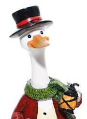 Mr Duck Christmas decoration in black top hat carrying a glowing lantern
