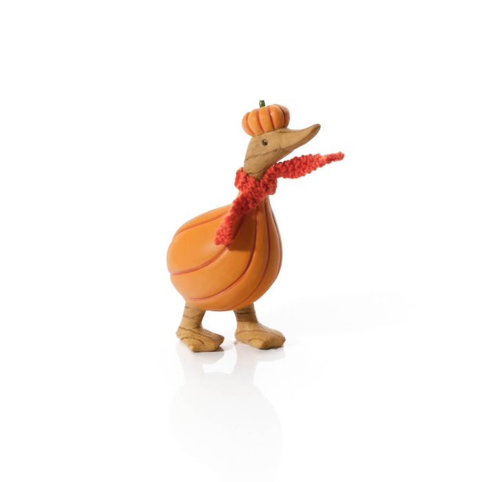 Pumpkin duck resin figurine with orange pumpkin-shaped body, pumpkin hat with green stem and red fluffy knitted scarf, white background