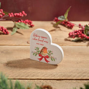 Robins appear when loved ones are near" white heart decoration with robin and holly illustration, styled on wooden surface with red berry branches