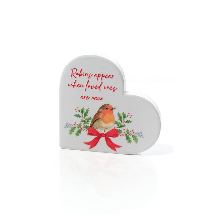 Robins appear when loved ones are near" white heart decoration with robin, holly and red bow illustration, white background