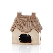 Rear view of cream stoneware thatched cottage tealight holder showing large open arch for tealight, Stoneware Country Cottage Collection