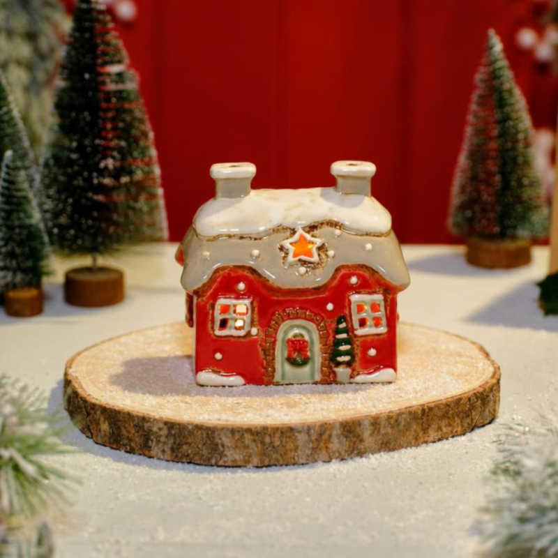 Red stoneware Christmas cottage tealight holder with snow-effect roof and star cutout, Stoneware Country Cottage Collection