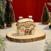 White stoneware Christmas cottage tealight holder with snow-effect roof and star cutout, Stoneware Country Cottage Collection