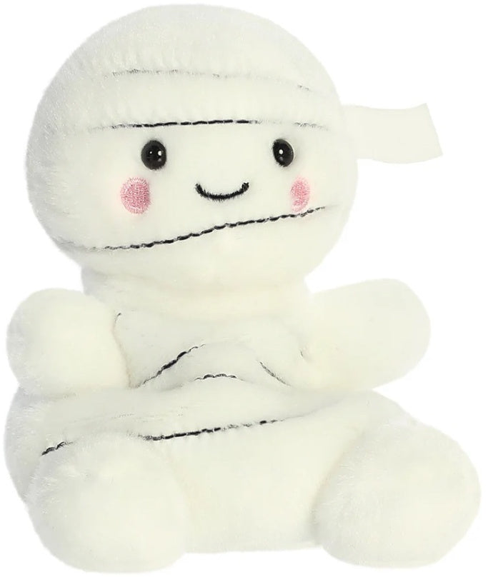 Angled front view of Brendan the Mummy Palm Pal showing the cream bandage wrapping and rosy cheeks