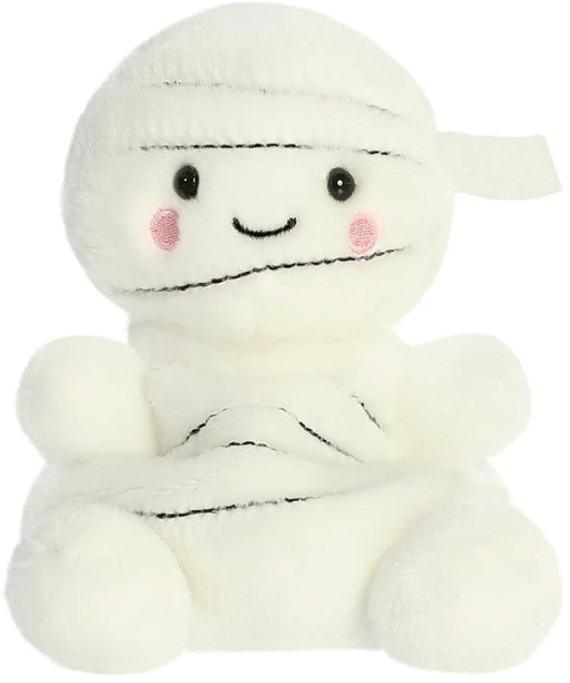 Brendan the Mummy Palm Pal a spooky-cute cream plush wrapped in bandage-style detail with dark stitch lines shiny black eyes rosy cheek circles and a sweet smile shown from the front