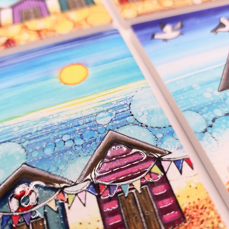 Close-up of Beach Hut and Bunting ceramic coaster showing embossed beach hut and bunting detail with bubble-effect sea