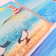 Close-up of Seagull and Lighthouse ceramic coaster showing embossed texture detail with seagulls and lighthouse