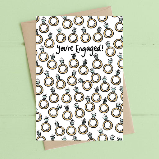 You're engaged congratulations card with gold foil finish, printed on luxury 300gsm FSC-certified board, supplied with recycled brown kraft envelope, 114x162mm


