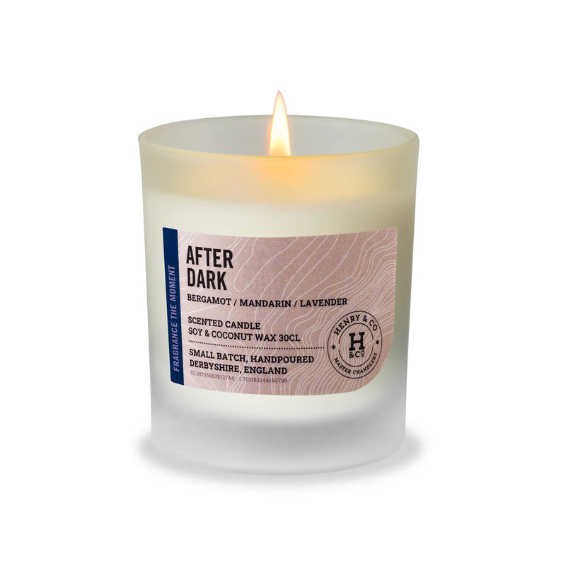 Henry & Co After Dark scented candle 30cl lit in a frosted glass vessel on a white background