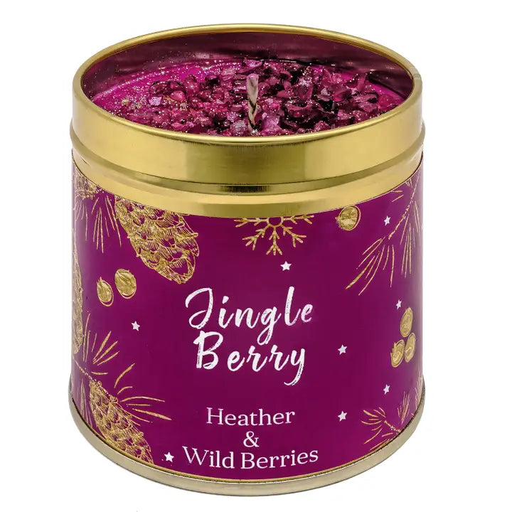 Festive Christmas candle tin with sparkly topping, pine cone and botanical design, labelled Jingle Berry with Heather & Wild Berries