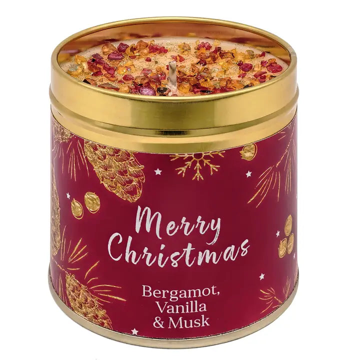 Festive Christmas candle tin with sparkly topping, pine cone and botanical design, labelled Merry Christmas with Bergamot, Vanilla & Musk