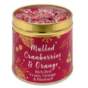 Festive Christmas candle tin with sparkly topping, pine cone and botanical design, labelled Mulled Cranberries & Orange with Rich Red Fruits, Orange & Rhubarb