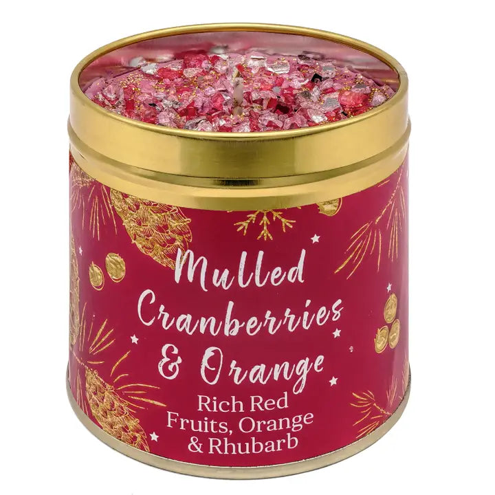 Festive Christmas candle tin with sparkly topping, pine cone and botanical design, labelled Mulled Cranberries & Orange with Rich Red Fruits, Orange & Rhubarb