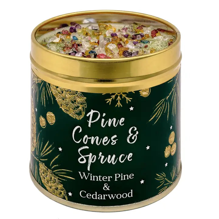 Festive Christmas candle tin with sparkly topping, pine cone and botanical design, labelled Pine Cones & Spruce with Winter Pine & Cedarwood