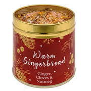 Festive Christmas candle tin with warm sparkly topping, pine cone and botanical design, labelled Warm Gingerbread with Ginger, Cloves & Nutmeg