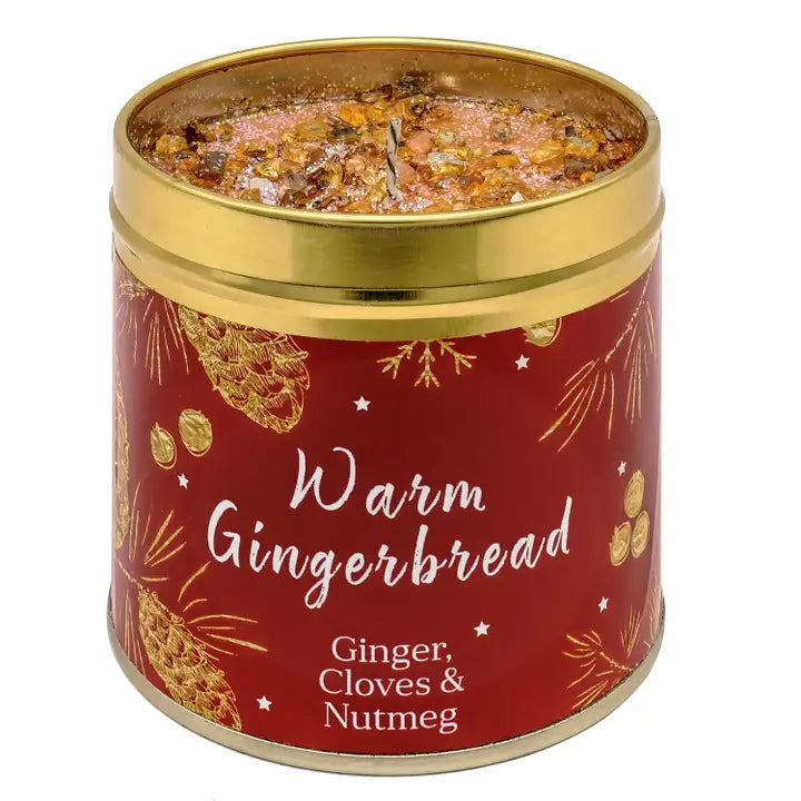 Festive Christmas candle tin with warm sparkly topping, pine cone and botanical design, labelled Warm Gingerbread with Ginger, Cloves & Nutmeg