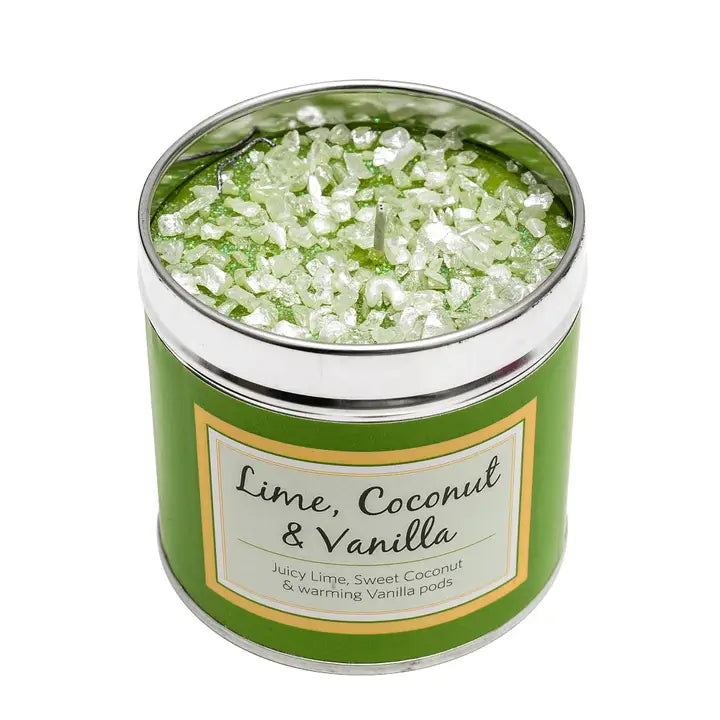 Lime, Coconut & Vanilla scented candle in a green tin with sparkly topping, label reading "Lime, Coconut & Vanilla — Juicy Lime, Sweet Coconut & warming Vanilla pods", white background