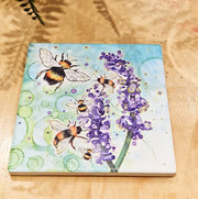 Bumblebee and Lavender ceramic coaster flat lay on wooden surface showing full design from above