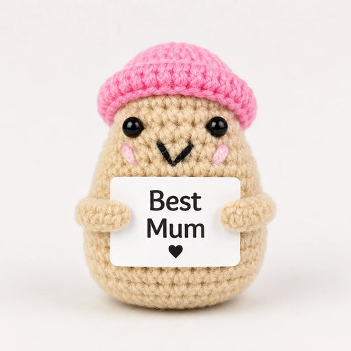 Best Mum Positive Crochet Gift character wearing a pink beanie hat holding a Best Mum sign, presented on a white background