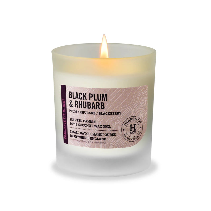 Henry & Co Black Plum and Rhubarb scented candle 30cl lit in a frosted glass vessel on a white background