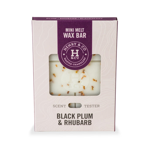 Henry & Co Mini Melt Wax Bar in Black Plum and Rhubarb fragrance in cream and purple packaging with window showing white wax bar with botanical inclusions on white background