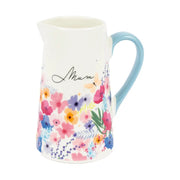 Meadow Mum bone china floral jug with wrap-around flower design and pastel blue handle, front view on white background