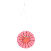Celestial Dreams The Sun air freshener hanging by its white cord showing the full circular sun face design on a white background