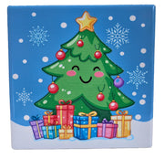 Ceramic Christmas coaster featuring a smiling Christmas tree decorated with baubles and topped with a star, standing behind wrapped presents with snowflakes in the background.