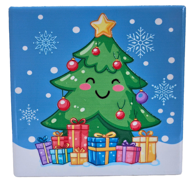 Ceramic Christmas coaster featuring a smiling Christmas tree decorated with baubles and topped with a star, standing behind wrapped presents with snowflakes in the background.