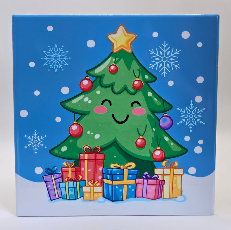 Square Christmas trivet featuring a smiling tree decorated with baubles and topped with a star, with wrapped presents beneath it and snowflakes in the background