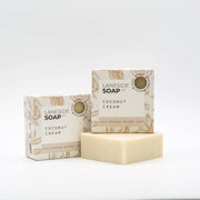 Laneside Soap Co Coconut Cream Soap Bar 135g alongside two cream boxes with botanical print on a light grey background