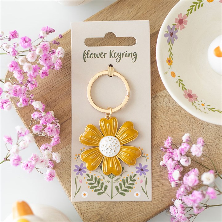 Yellow daisy enamel keyring – lifestyle view