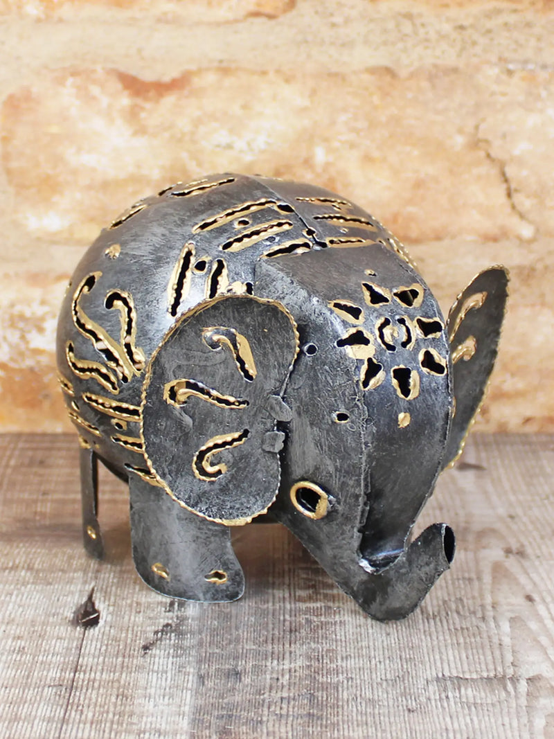 Dark metal elephant ornament large 12cm, handmade in Bali, intricate gold-coloured cut-out pattern detail and downward-curving trunk