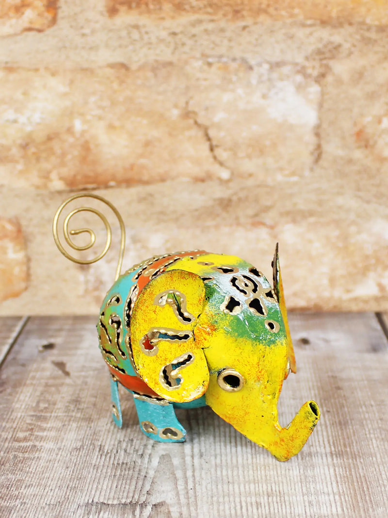 Colourful hand-painted metal elephant ornament small 8cm, handmade in Bali, intricate cut-out pattern detail, gold-coloured wire tail and upturned trunk