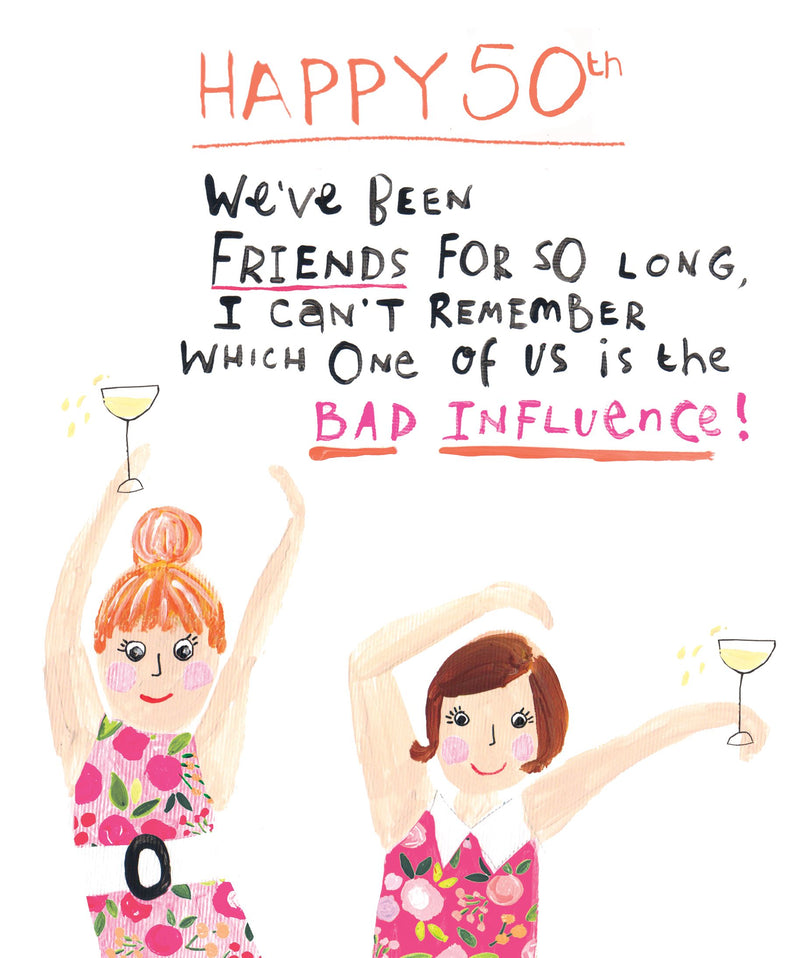 Funny 50th birthday card with two illustrated women in pink floral dresses dancing and holding glasses of wine, with the text "Happy 50th! We've been friends for so long, I can't remember which one of us is the bad influence!"