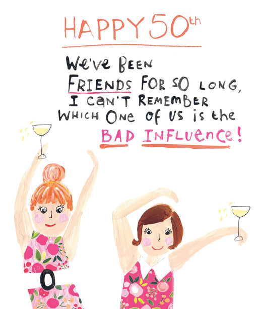 Funny 50th birthday card with two illustrated women in pink floral dresses dancing and holding glasses of wine, with the text "Happy 50th! We've been friends for so long, I can't remember which one of us is the bad influence!"