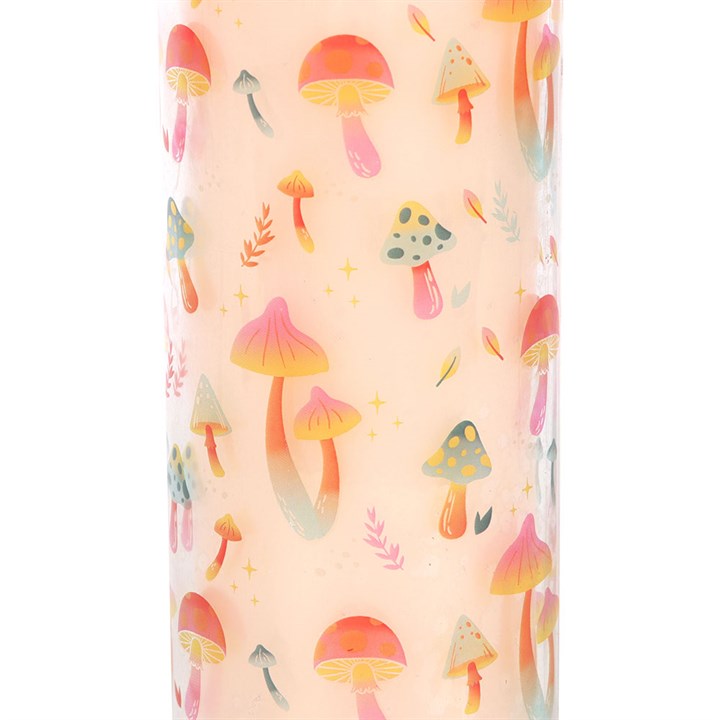Close-up of Funky Fungi candle wrap featuring colourful illustrated mushrooms in pink, orange and green on a white background

