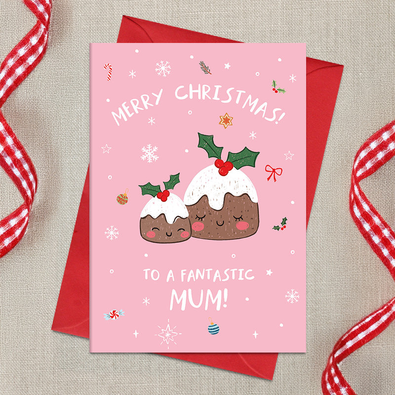 Fantastic Mum Christmas card featuring two smiling illustrated Christmas puddings topped with icing and holly, surrounded by snowflakes and festive decorations, with a Merry Christmas greeting