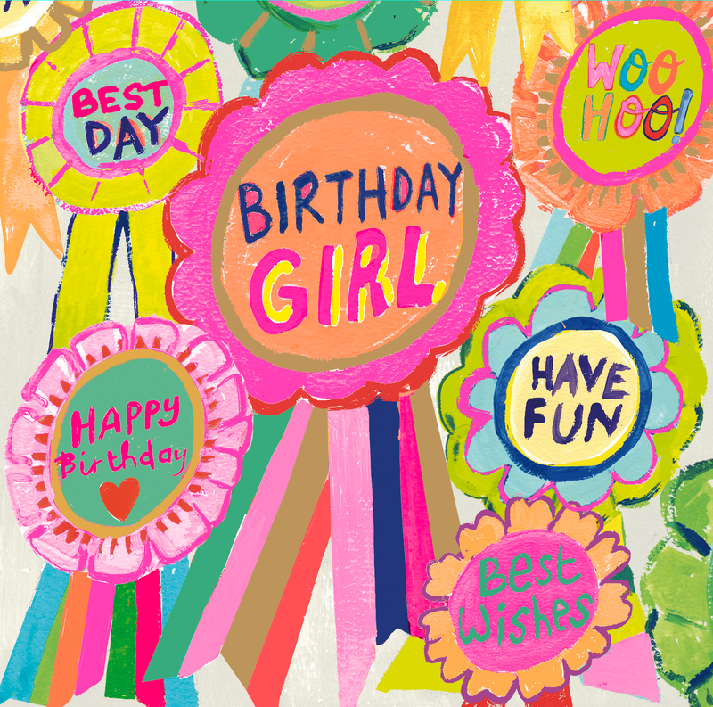 Birthday Girl Rosettes card — bold illustrated colourful rosettes with "Birthday Girl", "Best Day", "Woo Hoo!", "Happy Birthday", "Have Fun" and "Best Wishes" lettering