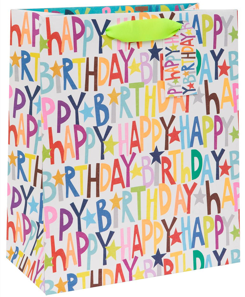Paper Salad Happy Birthday Large Gift Bag with multicoloured Happy Birthday lettering and star design on white background, lime green ribbon handles and matching gift tag, 260 x 315 x 135 mm, on white background